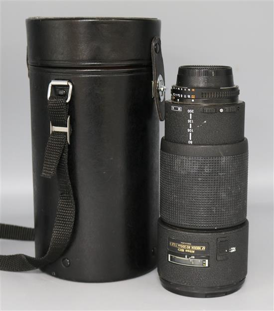 A Nikon ED AF Nikkor F2.8 80-200mm lens with rear cap and case